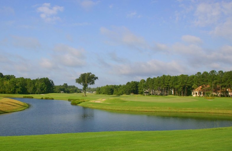 The Pete Dye Signature golf course at Hampton Hall — lake, links and Lowcountry pines