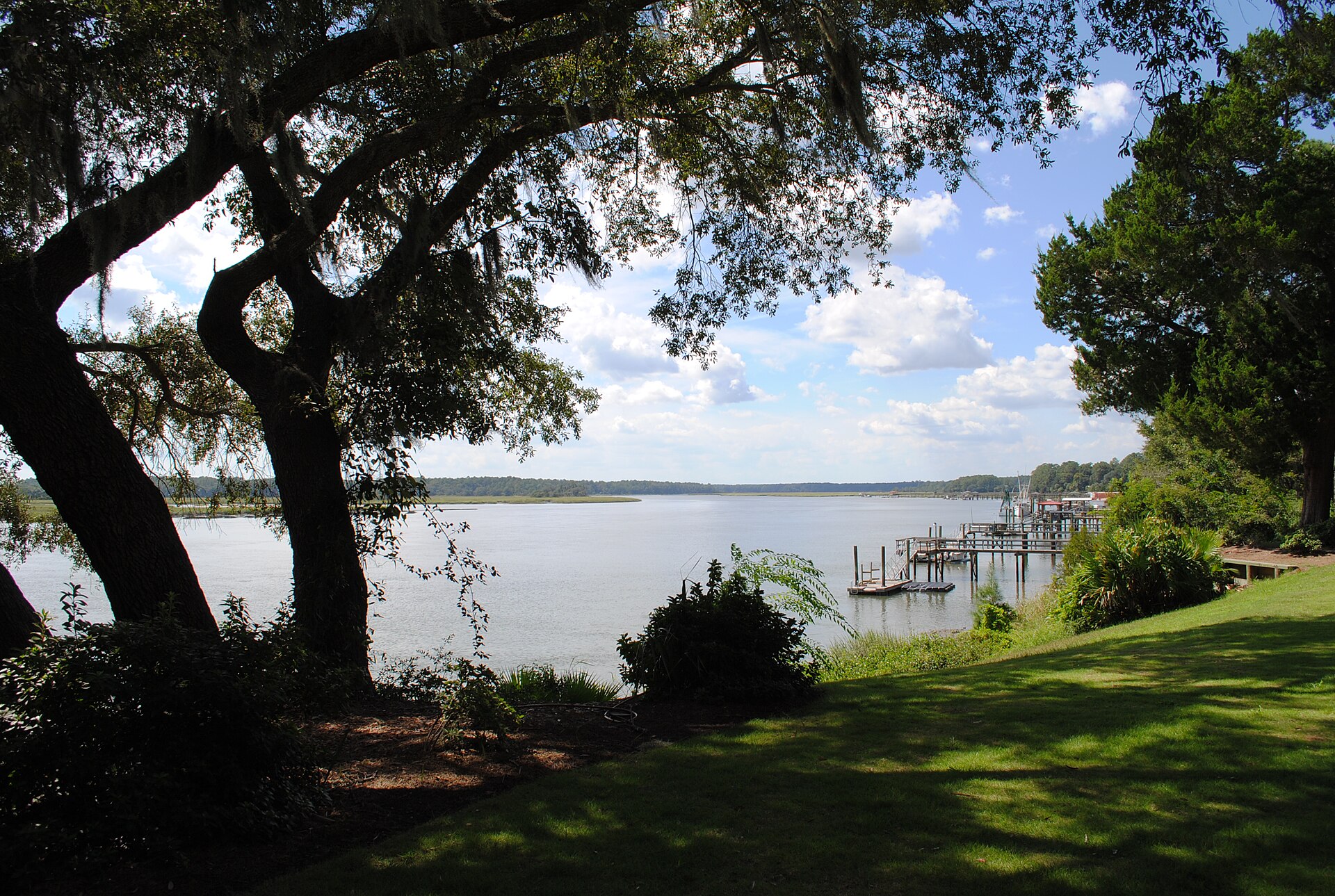 Live oaks draped in Spanish moss framing the May River in Bluffton, South Carolina
