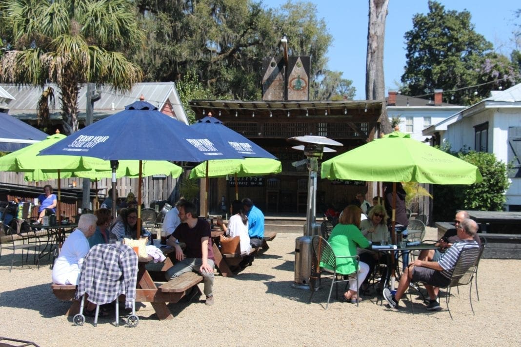 Open-air dining beneath live oaks in Old Town Bluffton
